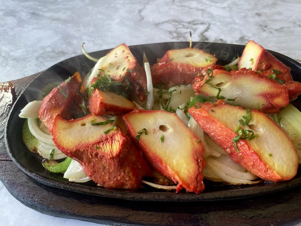 Chicken tikka on a sizzler